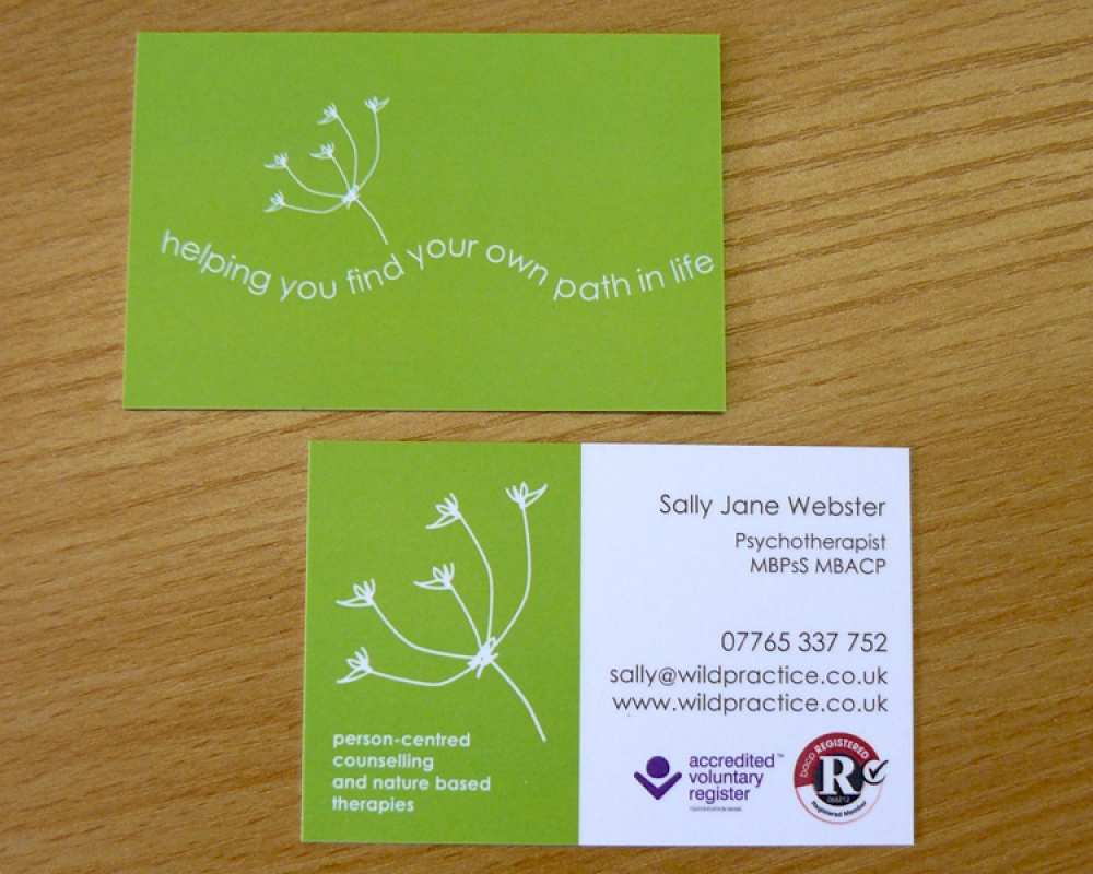 Two versions of the Wild Practice business card showing brand development