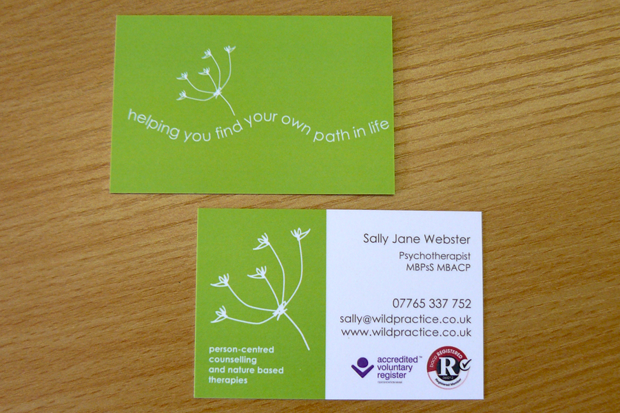Two versions of the Wild Practice business card showing brand development