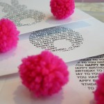 Image of cards being made with hand made pink pom poms